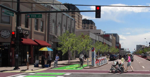 A rendering of what a two-way parking-protected bike lane might look like on lower Broadway. Image: City and County of Denver