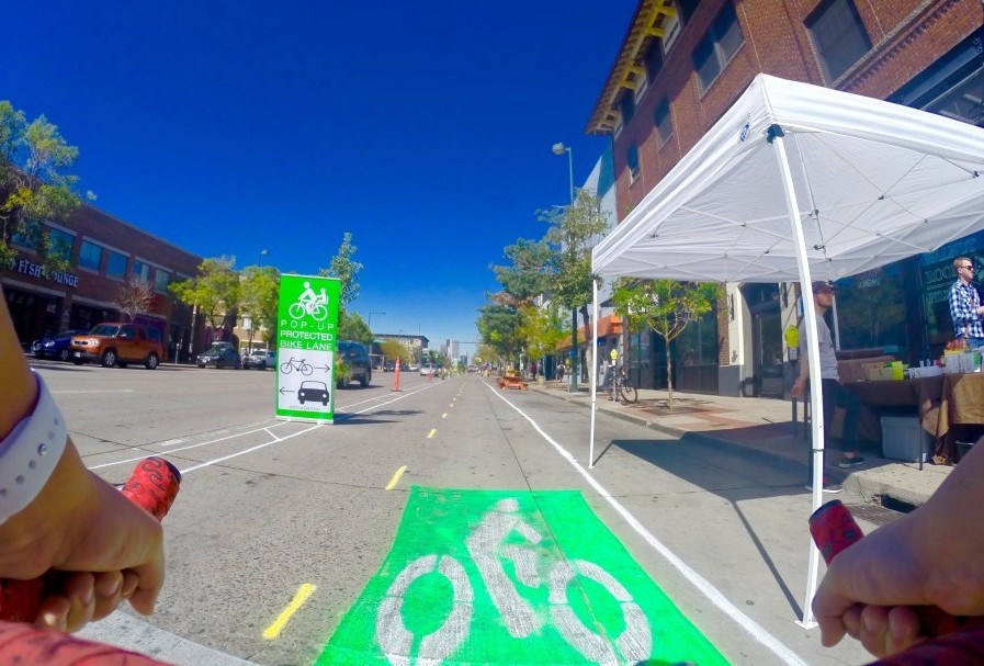 A bike rider tests out the temporary "pop-up" bike lane on Broadway in September. Photo: BikeDenver