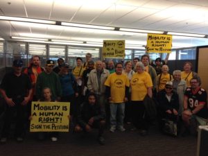 Members of Seattle's Transit Riders United at a King County Council meeting where they called for expanding the city's discount transit fare program. Photo: TRU