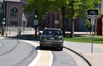 Perhaps this person parked in the bike lane because the sign actually says it's allowed. Photo: David Sachs