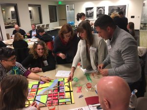 Citizens Academy students play Citizensville, a board game created by Transit Alliance about prioritizing city funds. Photo: Jamie Perkins