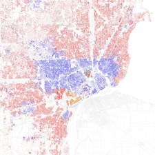 The red dots represent white residents and the blue dots represent black residents in this map of metro Detroit. It's easy to see Eight Mile Road, the dividing line between Wayne County, which includes Detroit, and suburban Oakland and Macomb counties to the north. Map: Eric Fischer