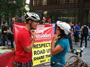 The only photo in the city of Chicago's online section about Bike Safety & Education is this image of a cyclist helping another cyclist fit her helmet. Photo: City of Chicago