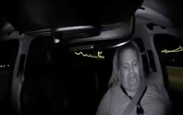 A video released by Tempe police from inside the Uber car shows the backup driver's attention diverted from the road before the collision that killed Elaine Herzberg.