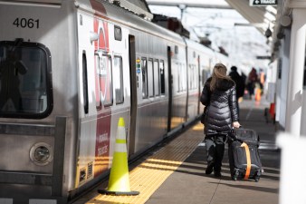A passenger prepares to board an RTD A-Line train at Union Station on January 30. Streetsblog file photo by Andy Bosselman.