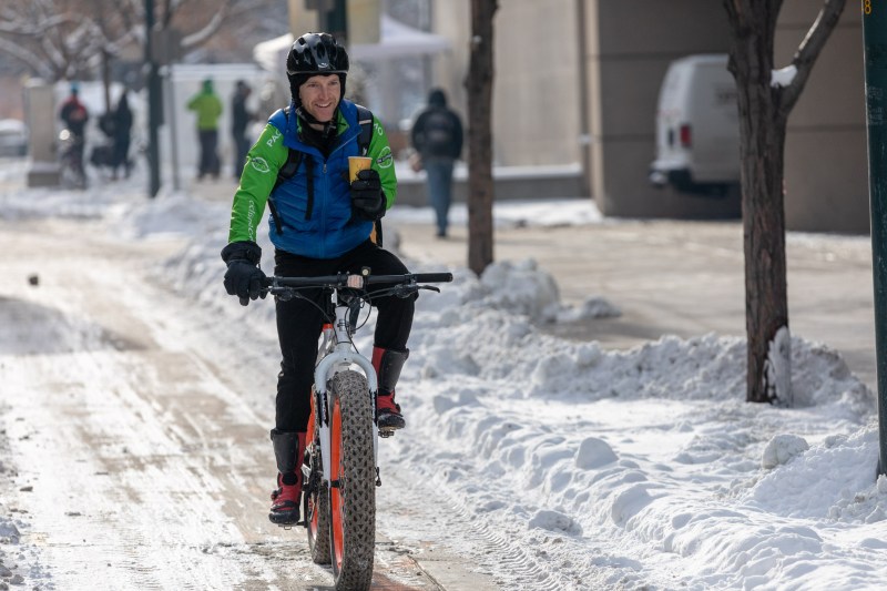 Rolf Eisinger, Denver's Vision Zero manager, rides near the Webb Municipal building.