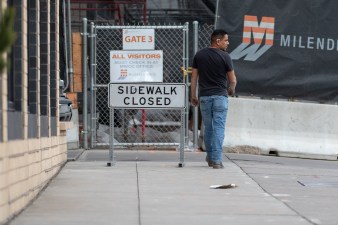 A pedestrian comes to a closed sidewalk at a construction site on 19th St. near Wewatta on Mar. 27, 2019. Photo: Andy Bosselman