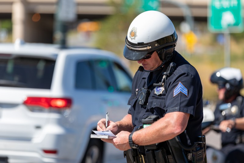 Sgt. Troy Zimmerman writes a traffic citation. Photo: Andy Bosselman