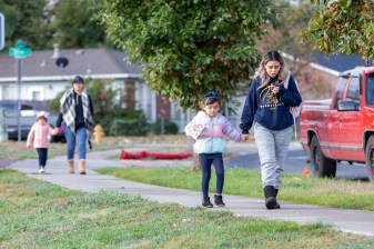 Bella Rivera holds the hand of her mother Esther on her their way to school. "My daughter knows you need to hold onto me. Drivers don't care." Photo: Andy Bosselman