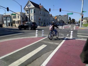 A cyclist traveling across 8th and Madison in Oakland. Photo: Roger Rudick