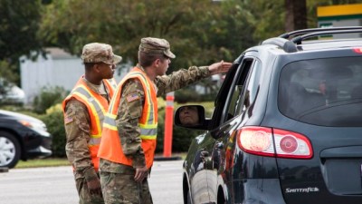 South Carolina National Guard Soldiers from B Battery, 1st of the 178th Field Artillery work with South Carolina Highway Patrol officers at a traffic control point in Conway, S.C. during the lane reversal of Highway 501 in support of the Myrtle Beach area evacuation to safeguard the citizens of the state in advance of Hurricane Florence, Sept. 11, 2018.  Approximately 2,000 Soldiers and Airmen have been mobilized to prepare, respond and participate in recovery efforts for Hurricane Florence, a Category 4 storm, with a projected path to make landfall along the Carolinas and east coast.  (U.S. Army National Guard Photo by Staff Sgt. Erica Knight, 108th Public Affairs Detachment)