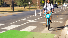 Man rides a bike in a bike lane