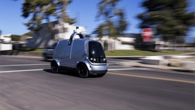 Photo of Nuro Self-Driving Delivery Vehicle moving on a street