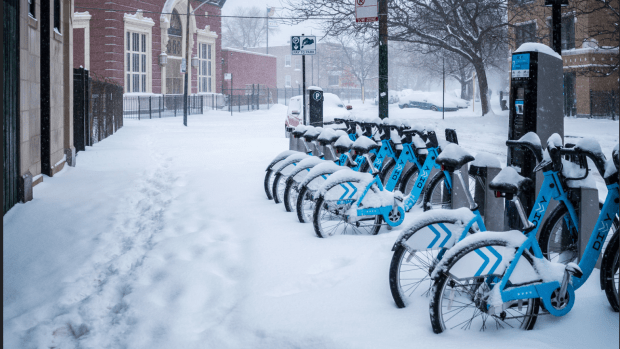 Docked bikeshare bikes in snow, credit Andrew Seaman via Creative Commons