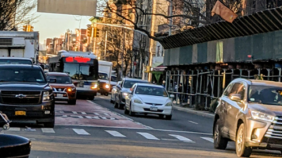 In NYC, a legally right turning truck in the bus lane causes the M15-SBS to travel in the adjacent lane.