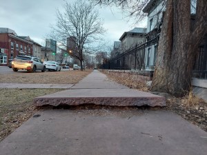 Egregiously disjointed pink flagstone sidewalk